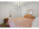 Bedroom with wood floors, dresser, and double door closet at 4110 Boca Woods Dr, Orlando, FL 32826