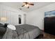 Bedroom with ceiling fan, double door closet, dresser, and carpet at 4110 Boca Woods Dr, Orlando, FL 32826