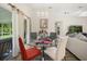 Open dining area with modern lighting, stylish furniture, and access to the patio at 4110 Boca Woods Dr, Orlando, FL 32826