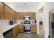 Well-lit kitchen featuring ample counter space and stainless steel appliances at 4110 Boca Woods Dr, Orlando, FL 32826