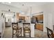 Modern kitchen with stainless steel appliances, wood cabinets, and a breakfast bar at 4110 Boca Woods Dr, Orlando, FL 32826