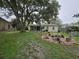 Lush backyard featuring a patio, mature trees, and shed at 4123 Gander Ave, Orlando, FL 32822