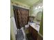 Well-lit bathroom with shower, vanity, and medicine cabinet at 4123 Gander Ave, Orlando, FL 32822