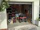 This is a garage full of storage solutions, tools, and equipment including a lawn mower at 4123 Gander Ave, Orlando, FL 32822