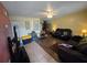 Spacious living room with tile and wood flooring, offering a comfortable layout at 4123 Gander Ave, Orlando, FL 32822