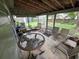 Spacious screened porch with tile flooring, outdoor furniture, and views of the backyard at 4123 Gander Ave, Orlando, FL 32822