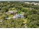 Aerial view of the home showcasing the mature landscaping, pool, and the overall layout of the property at 4454 Aspenwood Ct, Orlando, FL 32835