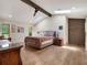 Spacious main bedroom with vaulted ceilings, hardwood floors, and a decorative wood beam at 4454 Aspenwood Ct, Orlando, FL 32835