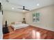 Spacious bedroom with hardwood flooring, recessed lighting and a window view to the garden at 4454 Aspenwood Ct, Orlando, FL 32835