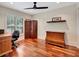 Bedroom with rich hardwood floors, decorative shelf, and an antique wood dresser at 4454 Aspenwood Ct, Orlando, FL 32835
