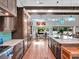 Spacious kitchen with dark wood cabinetry, stainless steel appliances, and a large center island at 4454 Aspenwood Ct, Orlando, FL 32835