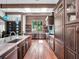 Modern kitchen with wood accents, sleek countertops, and premium appliances at 4454 Aspenwood Ct, Orlando, FL 32835