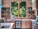 Kitchen bar featuring a wine refrigerator, espresso machine, shelving and lots of counter space at 4454 Aspenwood Ct, Orlando, FL 32835