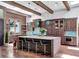 Gourmet kitchen with a large island, custom cabinetry, and stainless steel appliances at 4454 Aspenwood Ct, Orlando, FL 32835