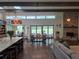 Open-concept living area with hardwood floors, exposed beams, fireplace, skylights and natural light at 4454 Aspenwood Ct, Orlando, FL 32835