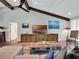 Inviting living room with vaulted ceilings, exposed beams, and cozy seating area at 4454 Aspenwood Ct, Orlando, FL 32835