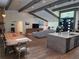 Bright living room featuring hardwood floors, high ceilings with wooden beams, and stylish contemporary decor at 4454 Aspenwood Ct, Orlando, FL 32835