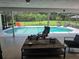 Inviting screened-in pool area with comfortable lounge chairs, perfect for relaxing outdoors in a private setting at 4454 Aspenwood Ct, Orlando, FL 32835
