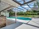 Inviting pool and outdoor living area with a convenient bar area, perfect for entertaining guests by the pool at 4454 Aspenwood Ct, Orlando, FL 32835