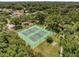 Aerial view of two well-maintained tennis courts surrounded by mature trees at 4454 Aspenwood Ct, Orlando, FL 32835