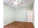 Bedroom featuring hardwood floors and a ceiling fan at 451 Acacia Tree Way, Kissimmee, FL 34758