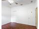 Bedroom featuring hardwood floors, ceiling fan, and closet at 451 Acacia Tree Way, Kissimmee, FL 34758
