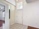 Bright entryway featuring tile flooring, high ceilings and natural light at 451 Acacia Tree Way, Kissimmee, FL 34758