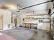Garage featuring abundant shelving and access door at 451 Acacia Tree Way, Kissimmee, FL 34758