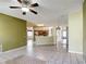 Spacious living room flows into the kitchen and patio area at 451 Acacia Tree Way, Kissimmee, FL 34758