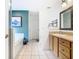 Bathroom featuring a vanity sink, bathtub, shower, and tile flooring at 512 Viola Dr, Davenport, FL 33837