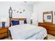 Comfortable bedroom features custom Peter Pan wall art and light wood flooring at 512 Viola Dr, Davenport, FL 33837