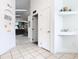 Bright hallway featuring tiled floors, art niches and an open view to the living area at 512 Viola Dr, Davenport, FL 33837