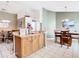 Open layout featuring the kitchen breakfast bar with seating, adjacent to the dining area at 512 Viola Dr, Davenport, FL 33837