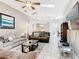 Comfortable living room with vaulted ceilings, skylights, and an open-concept design at 512 Viola Dr, Davenport, FL 33837