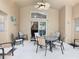 Covered outdoor patio area with seating and ceiling fan at 512 Viola Dr, Davenport, FL 33837