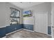 Cozy bedroom with two-tone paint, laminated floors, a TV and a window showing outside at 545 Hardwood Cir, Orlando, FL 32828