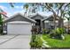 Charming single-Gathering home with well-manicured lawn and two-car garage at 545 Hardwood Cir, Orlando, FL 32828