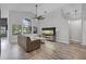 Bright living room with large window, high ceilings, and hardwood floors at 545 Hardwood Cir, Orlando, FL 32828