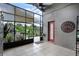 Enclosed outdoor patio featuring tiled floors, a ceiling fan and a seating area at 545 Hardwood Cir, Orlando, FL 32828