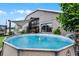 Private above ground pool in fenced backyard provides a relaxing retreat with yellow rubber ducky at 545 Hardwood Cir, Orlando, FL 32828