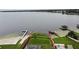 Aerial view of the property showcasing its lakefront location, dock, and access to the water at 5529 Hansel Ave, Orlando, FL 32809