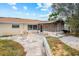 Exterior view of a home with a patio area, perfect for outdoor entertaining and relaxation at 5812 Viking Rd, Orlando, FL 32808