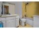 Retro bathroom featuring yellow tiles, a bathtub with shower, and a white vanity at 5812 Viking Rd, Orlando, FL 32808