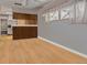 Bright open-concept living room with hardwood floors, recessed lighting, and seamless access to the adjacent kitchen at 5812 Viking Rd, Orlando, FL 32808