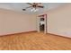 Bright, open living room features updated flooring and a ceiling fan with light fixture at 5812 Viking Rd, Orlando, FL 32808