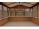 Enclosed wooden patio with lattice accents offering a serene space for relaxation and outdoor enjoyment at 5812 Viking Rd, Orlando, FL 32808