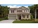 Charming two-story home featuring a two-car garage, neutral siding and lush landscaping at 650 Terrapin Dr, Debary, FL 32713