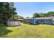 Expansive backyard with an above ground pool and lush green grass for outdoor enjoyment at 6663 Nw 60Th St, Ocala, FL 34482