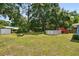 The generous backyard features a firepit, seating area, and pool, perfect for entertaining and relaxation at 6663 Nw 60Th St, Ocala, FL 34482