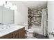 Well-appointed bathroom featuring modern tilework, vanity with drawers, and shower-tub combination at 6663 Nw 60Th St, Ocala, FL 34482
